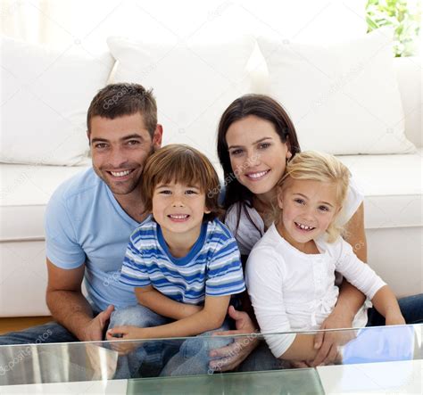 Portrait of happy family smiling in living-room — Stock Photo ...