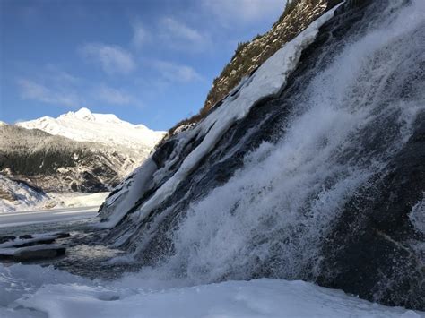 Nugget Falls cascades into Mendenhall Lake; Mendenhall Glacier in ...