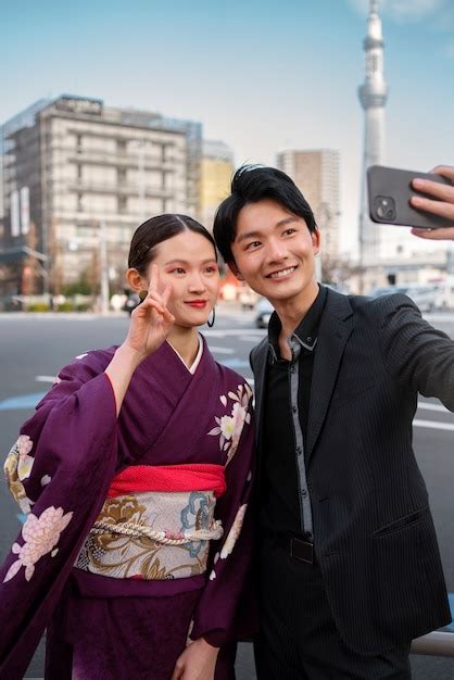 Free Photo Japanese Couple Celebrating Coming Of Age Day Outdoors By