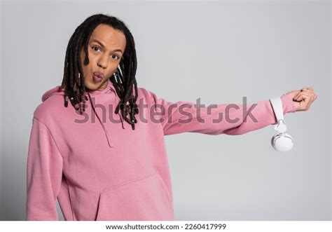 Multiracial Man Dreadlocks Pouting Lips While Stock Photo