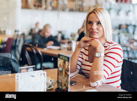 Portrait Of Beautiful Blonde Woman In Cafe Stock Photo Alamy