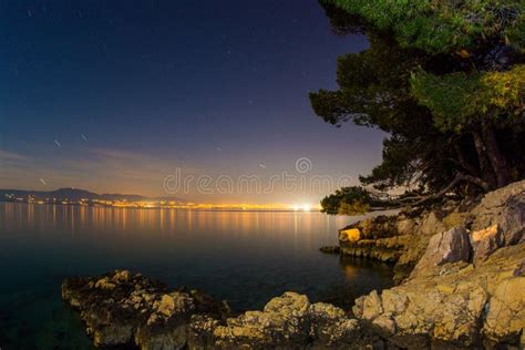 Rocky beach at night stock photo. Image of illuminated - 41479824