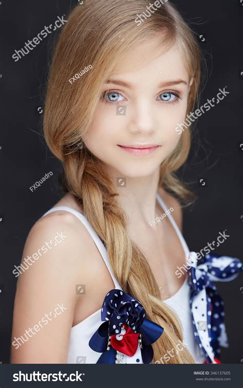 Pretty Girl With Dirty Blonde Hair And Blue Eyes