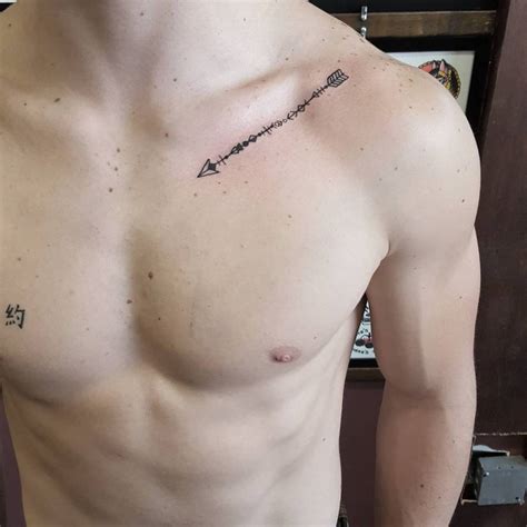 Arrow Tattoo Located On The Collarbone