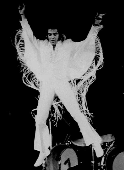 Elvis Tries To Fly In The Long Fringe Suit In 1970 Elvis Jumpsuits Elvis Presley Elvis