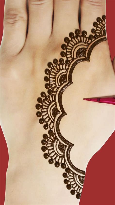 A Woman S Hand With Henna On It And A Pair Of Scissors In The Foreground