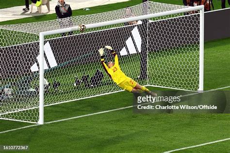 Spain goalkeeper Cata Coll sees a shot from Lauren Hemp of England ...