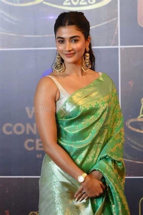 Sexy Pooja Hegde In A Sleeveless Green Silk Saree Photos