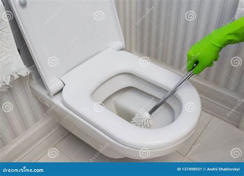 Man Cleaning Toilet With Spray Cleaner. Royalty-Free Stock Photo ...