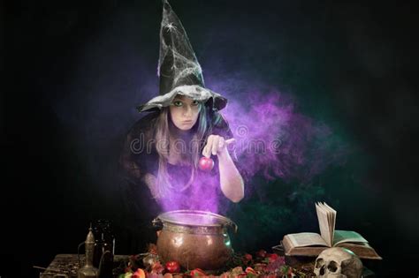 Halloween Witch Cooking A Potion In A Cauldron Stock Image Image