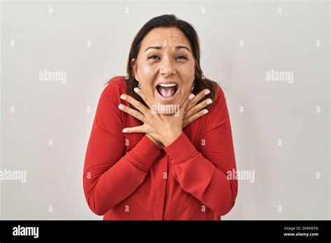 Hispanic Mature Woman Standing Over White Background Shouting And