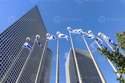 Israel, Tel Aviv, Israeli flags in financial business district skyline