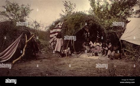 View of a Native American Apache camp, Arizona, shows a Chiricahua ...