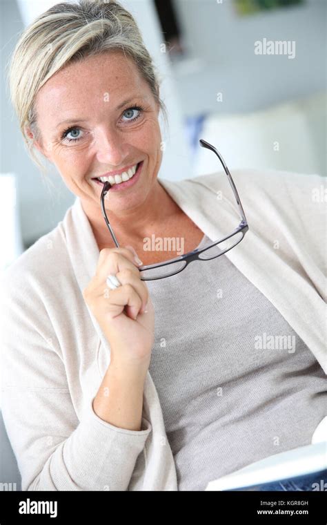 Mature Blond Woman Reading Book Stock Photo Alamy