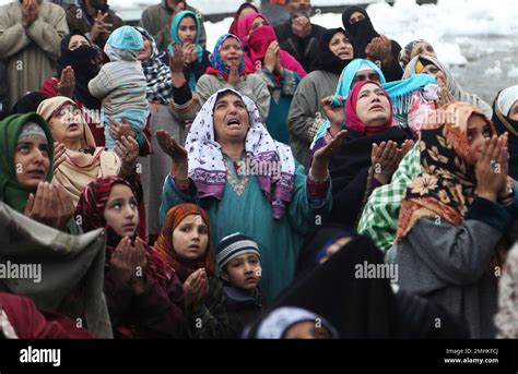 Kashmiri Muslims Pray As The Head Priest Unseen Displays A Relic Of