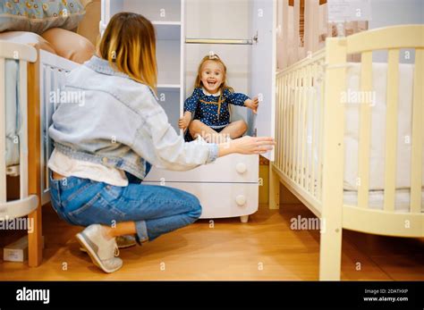 Mother And Little Daughter Play Hide And Seek Stock Photo Alamy