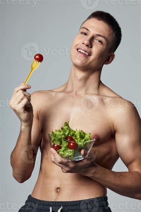 Cheerful Sporty Guy With A Naked Torso Plate With Salad Healthy Food