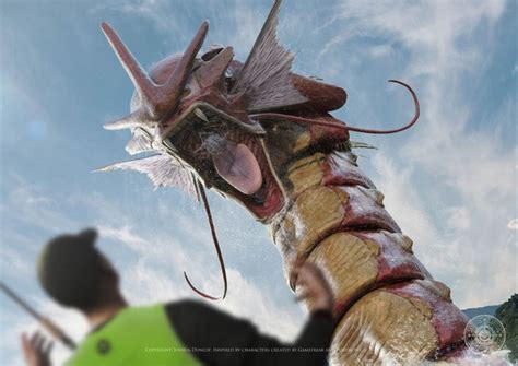 A Man Standing Next To A Giant Dragon With It S Mouth Open And Tongue Out