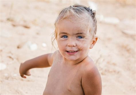 Premium Photo Portrait Of Cute Shirtless Girl At Beach