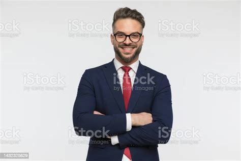 Happy Businessman With Glasses Crossing Arms Smiling And Posing Stock