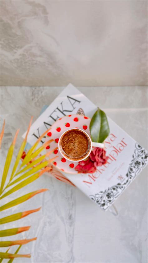 Book and a Cup of Coffee on a Table · Free Stock Photo