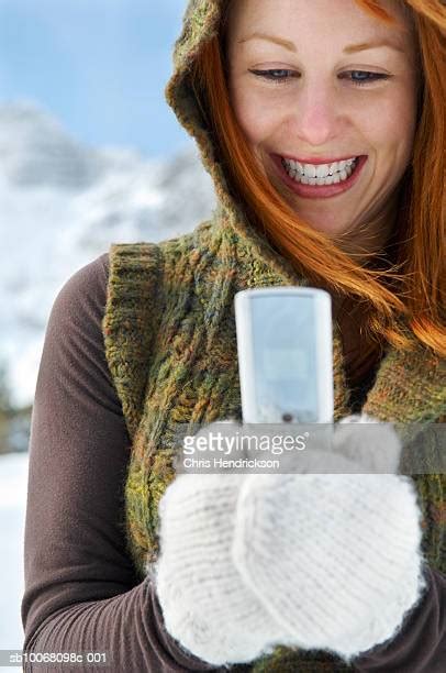 424 Winter Glove Holding Phone Stock Photos High Res Pictures And