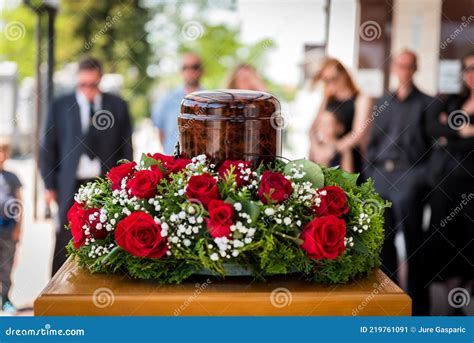 Funerary Urn With Ashes Of Dead And Flowers At Funeral Stock Image