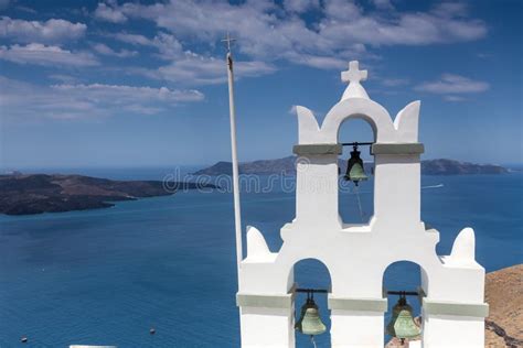 Traditional Greek White Church Arch With Cross And Bells In Village