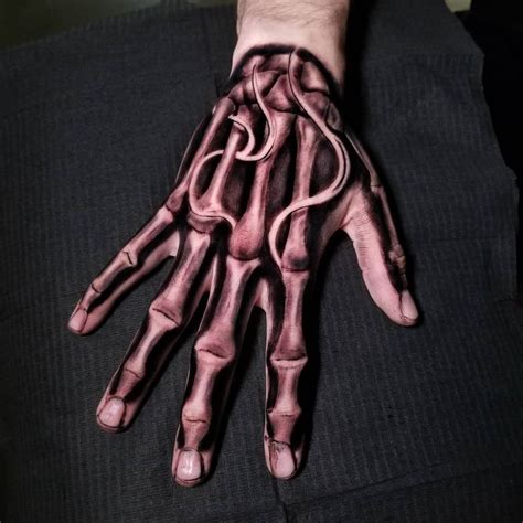 Skeleton Hand Tattoo Ideas And Meanings Skeleton Hand Tattoo Hand