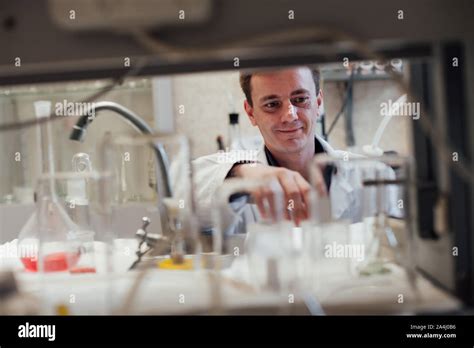 Scientist Conducts Chemical Experiments With Liquids In The Medical