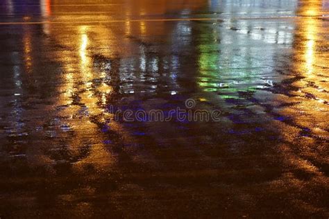 Colorful Water Reflection On The Road Night City Lights Reflected In