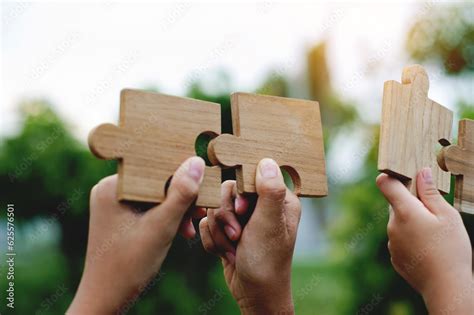 Jigsaw Puzzle In Hand Teamwork Together Communication Puzzle Piece