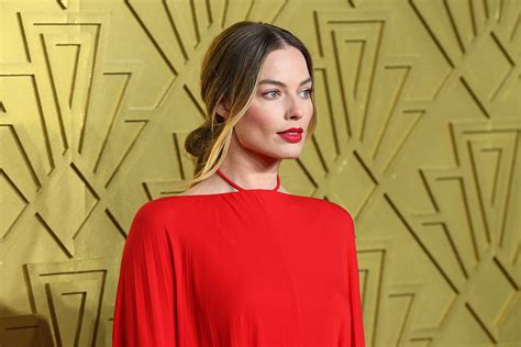 Margot Robbie Flows In Dramatic Red Dress Heels At Babylon Premiere