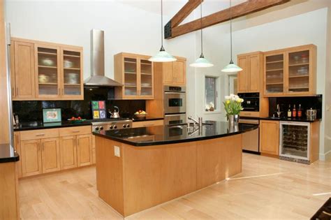 Dark Granite and Light Maple Cabinets | Maple kitchen cabinets, Modern kitchen flooring, Dark ...