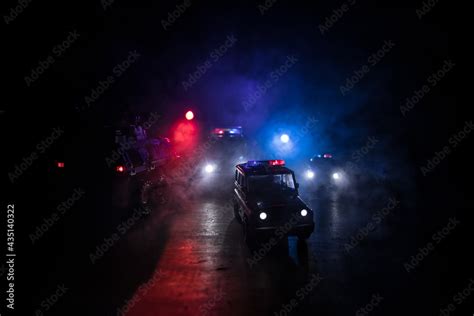 Police cars at night. Police car chasing a car at night with fog ...