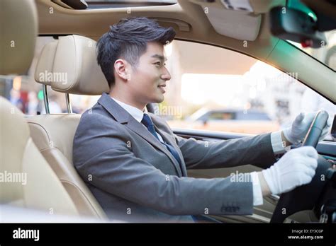 chauffeur driving car stock photo alamy