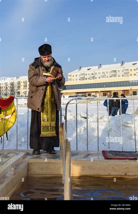 Priest Consecrates The Ice Hole On Epiphany Day Traditional Ice