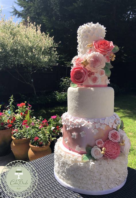 A 5 Tier Pink And White Ruffle And Sugar Flower Wedding Cake Sugar