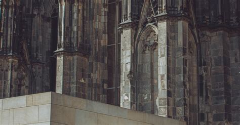 Man Sitting On Steps Of The Cologne Cathedral · Free Stock Photo