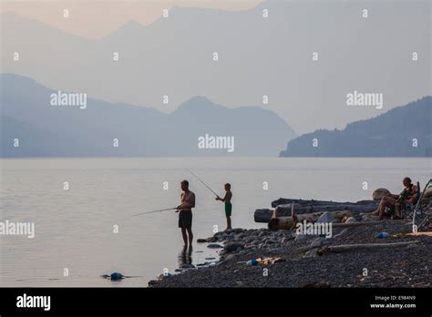 Father And Son Fishing On Slocan Lake New Denver Slocan Valley West