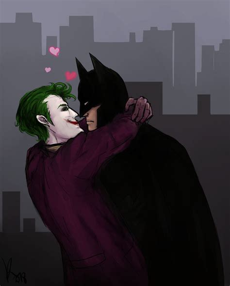 Two People Dressed As The Joker And Catwoman Kissing In Front Of A