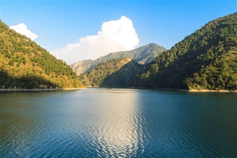 Chamera Lake A Lake Surrounded By Beautiful Green Trees And Exquisite