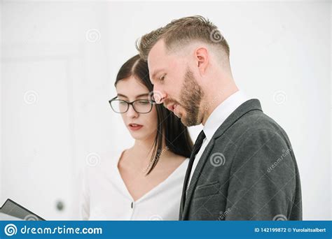 Couple Of Employees Discussing A Business Document Stock Photo Image