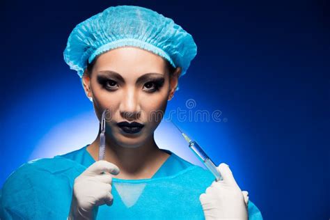 Doctor Nurse Woman In Uniform With Stethoscope And Syringe Stock Photo