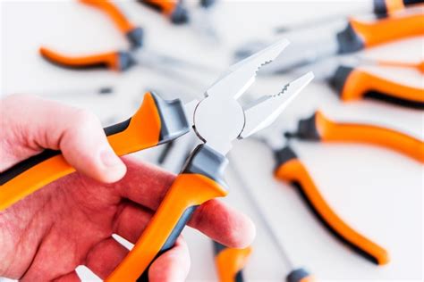 Premium Photo | Pliers in a hand