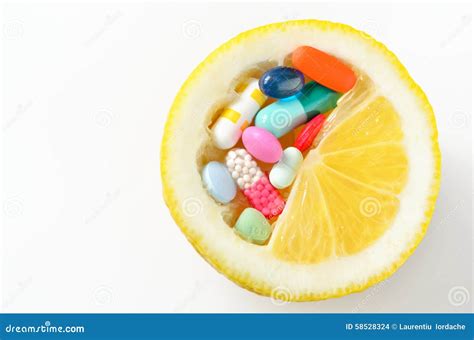 Pills and lemon isolated stock photo. Image of pharmacy - 58528324