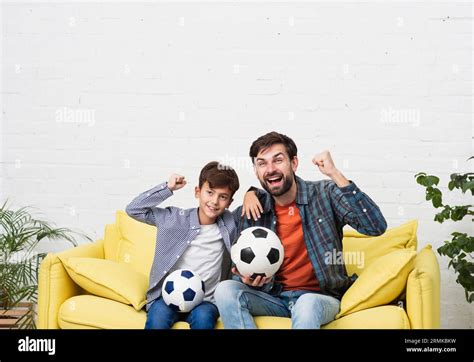 Father Son Watching Football Match Stock Photo Alamy