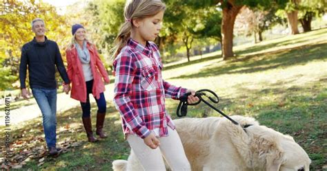 family walking with dog outdoors Stock Video | Adobe Stock