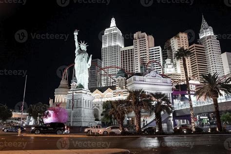 View of cars on road by Replica of Statue Of Liberty in New York, New ...