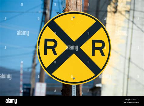 Railroad crossing road sign Stock Photo - Alamy